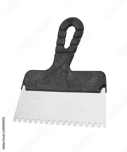 Notched spatula on white background. Handle notched spatula on white background. Stainless steel notched spatula with plastic handle
