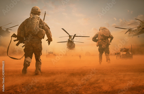 Military troops and helicopter on the way to the battlefield / Between sand storm in desert photo