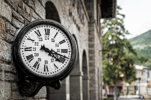 Old retro wall clock at Ribes de Freser funicular train station, Catalonia, Spain.