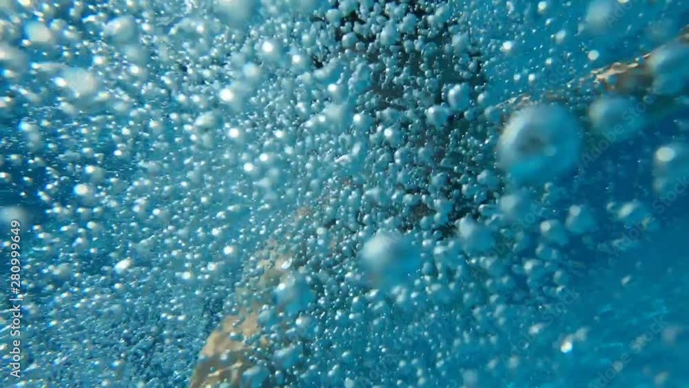Man swim underwater in a swimming pool, slow motion Man swim underwater in a swimming pool, slow motion