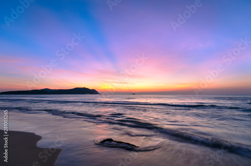 Dawn on the beautiful beach with full of purple colors in the sky welcomes the beautiful new day © huythoai