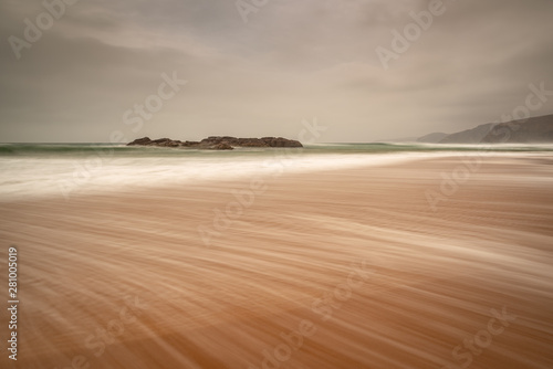 Sandwood Bay in early morning with Cape Wrath in far distance, Sutherland, Scotland