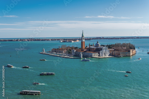Day view of San Giorgio Maggiore Island with church at Venetian lagoon, with Lido background view, Venice, Veneto
