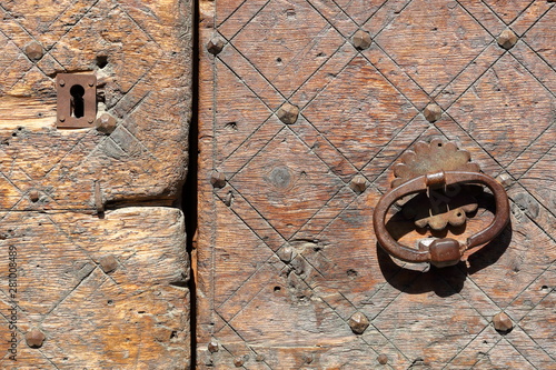 Close-up on a traditional wooden door in Saint Veran village, Queyras Regional Natural Park, Southern Alps, France photo