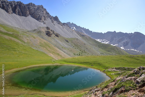 Souliers lake located above Izoard Pass (after one hour hike from Casse deserte car park), with reflections of mountain range, Queyras Regional Natural Park, Southern Alps, France