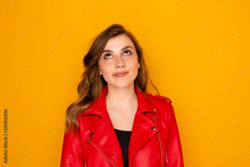 Funny cute model in orange studio posing isolated Funny cute model in orange studio posing isolated