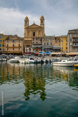 Boats moored in the port at Bastia with St. Jean Baptiste church, Bastia, Corsica, France, Mediterranean photo