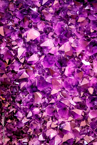 Amethyst purple crystal. Mineral crystals in the natural environment. Texture of precious and semiprecious gemstone