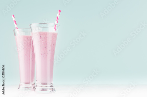 Wallpaper Mural Fresh summer blueberry yogurt with straws in two high glass in elegant pastel light mint color kitchen interior, copy space. Torontodigital.ca