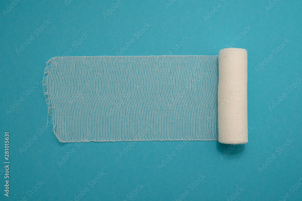 Fototapeta premium medical bandage isolated on blue background