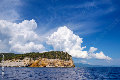 View of the shore from the sea. Landscape with the sea and beautiful clouds in the blue sky