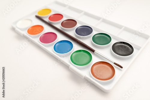 Top view of watercolor paint in box on white background