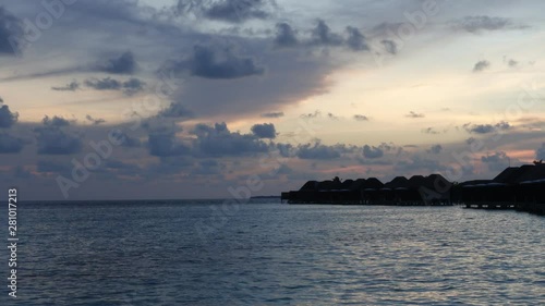 Sunset at Luxury water villa resort in Maldives, time lapse