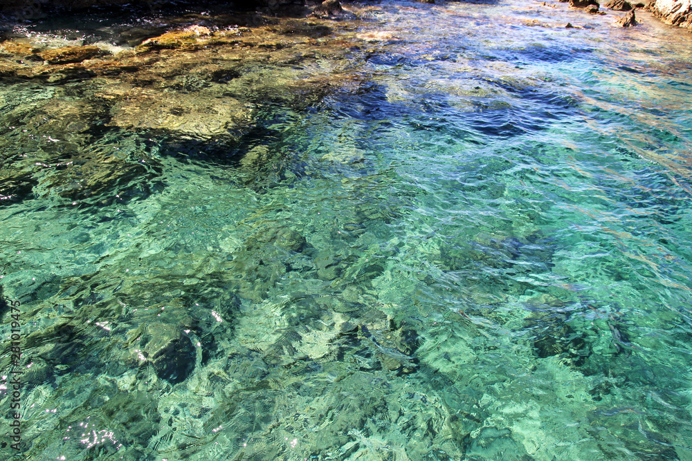 Sea coast and beach with rocks, rocky coastline, blue sea, good sunny day. Summer trip. Beautiful Greece. Most beautiful beach, natural environment, waves and tropical landscape, horizon and panorama. Sea coast and beach with rocks, rocky coastline, blue sea, good sunny day. Summer trip. Beautiful Greece. Most beautiful beach, natural environment, waves and tropical landscape, horizon and panorama.
