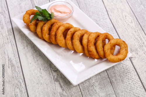 Hot onion rings snack with sauce