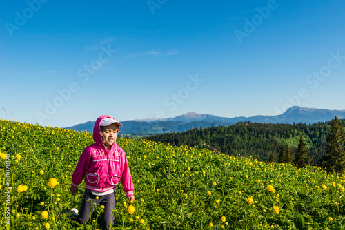 Girl on a flowering meadow.