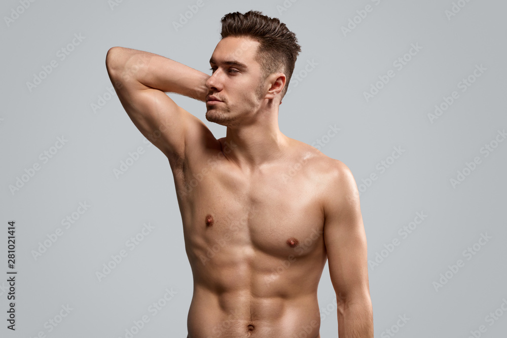 Muscular confident man looking away