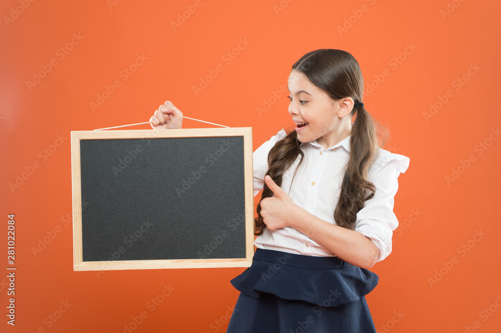 School schedule information. School girl cute pupil hold blackboard copy space. School announcement concept. Informing kids changes in school life. Good news for pupils community. Educational program School schedule information. School girl cute pupil hold blackboard copy space. School announcement concept. Informing kids changes in school life. Good news for pupils community. Educational program