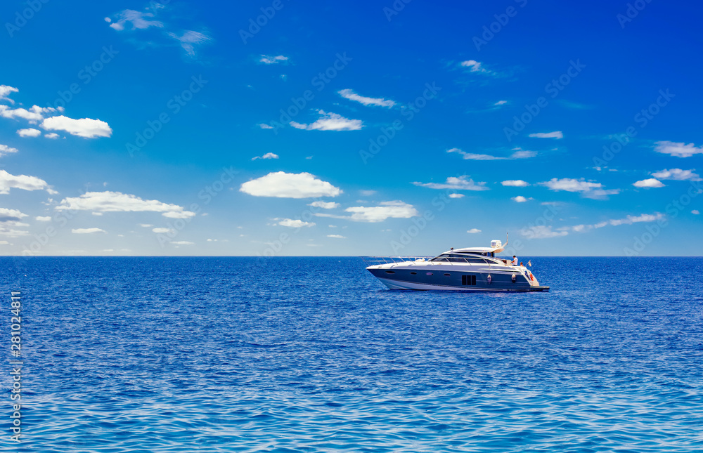 idyllic picturesque expensive cruise vacation concept photography of Mediterranean sea scenery landscape and lonely yacht floating on water, blue sky with white clouds background, empty space for text
