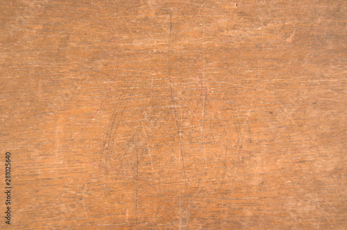Scratched surface of an old wooden school desk