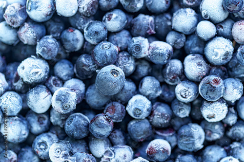 Frozen blueberries texture. Frozen berries with ice
