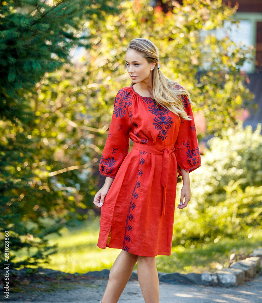 Beautiful blonde Ukrainian girl with blue eyes in folk clothing. Boho style in fashion. Traditional and nature style. National look Beautiful blonde Ukrainian girl with blue eyes in folk clothing. Boho style in fashion. Traditional and nature style. National look