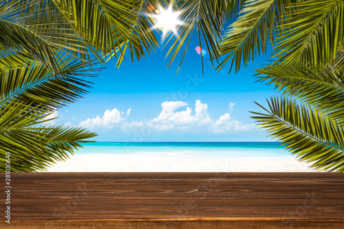 Table background with beautiful blue ocean and sandy beach view. Happy summer time. 