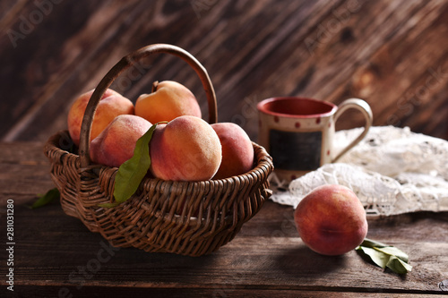 fresh ripe peaches in a wicker basket