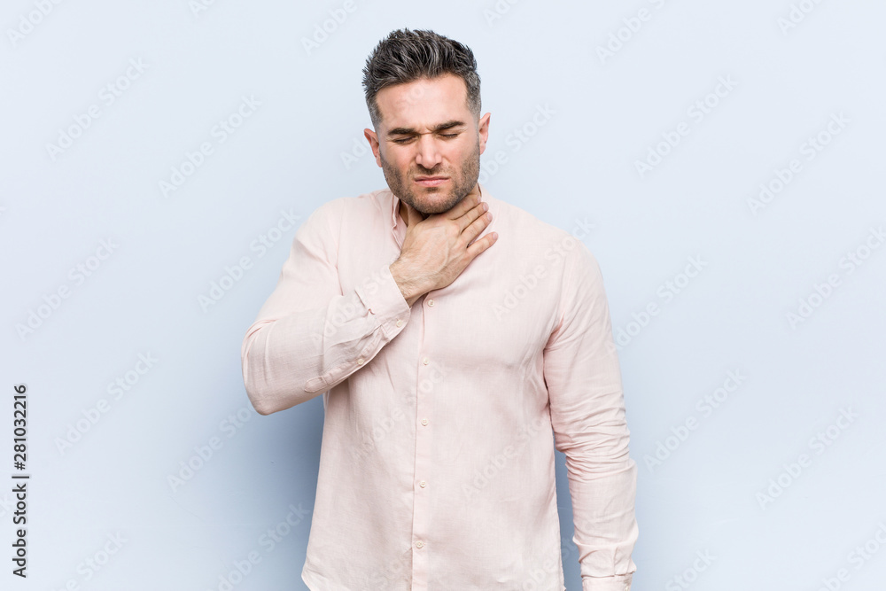 Young handsome cool man suffers pain in throat due a virus or infection. Young handsome cool man suffers pain in throat due a virus or infection.