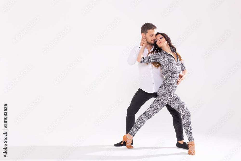 Young couple dancing social latin dance bachata, merengue, salsa. Two  elegance pose on white background with copy space Photos | Adobe Stock