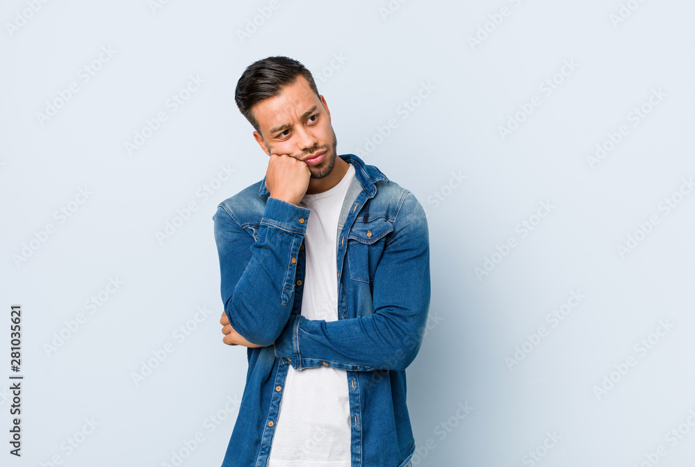 Young handsome filipino man who feels sad and pensive, looking at copy space. Young handsome filipino man who feels sad and pensive, looking at copy space.
