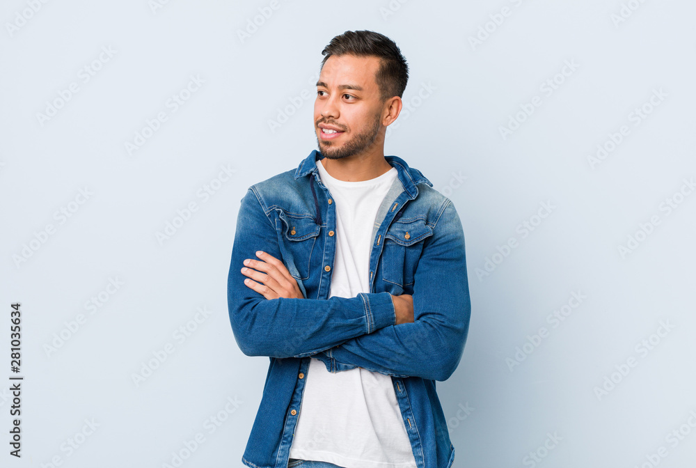 Young handsome filipino man smiling confident with crossed arms. Young handsome filipino man smiling confident with crossed arms.