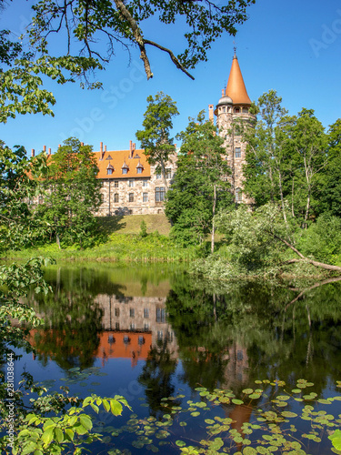 Cesvaine stone castle, beautiful summer day, pond, reflections, Latvia