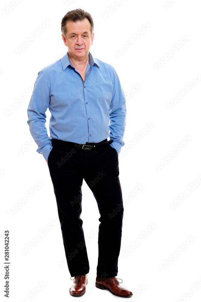 Fototapeta premium Business elderly man wearing formal clothes blue shirt and black pants posing on isolated background. The concept of business and positive pensioner. Advertising space