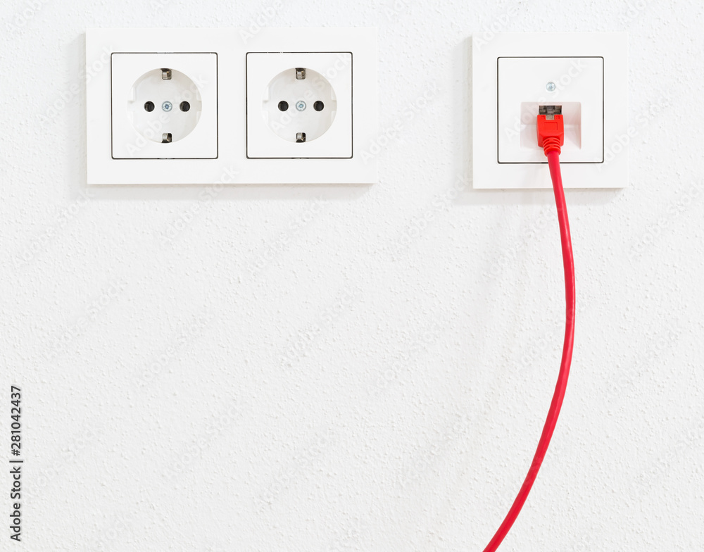Red network cable in wall outlet for office or private home lan ethernet connection power outlets flat view on white plaster wall de Stock | Stock