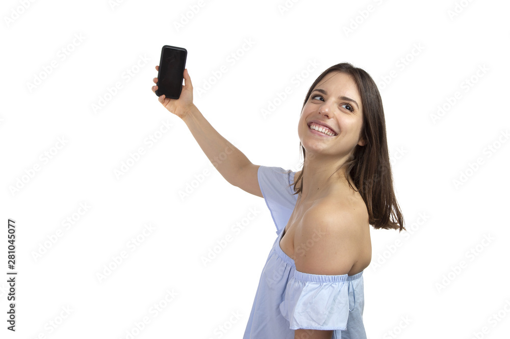 Attractive young girl taking a selfie on a white background Attractive young girl taking a selfie on a white background