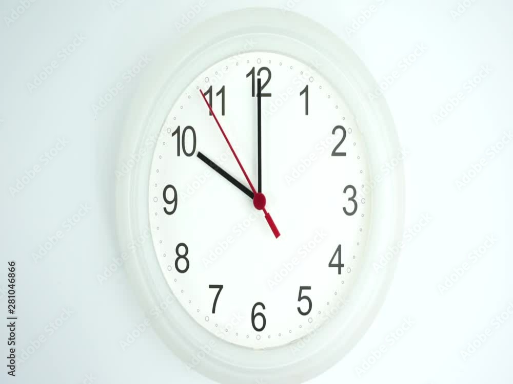 Closeup White wall clock face beginning of time 10.00 am or pm, Clock minute walk slowly, Time concept. Closeup White wall clock face beginning of time 10.00 am or pm, Clock minute walk slowly, Time concept.