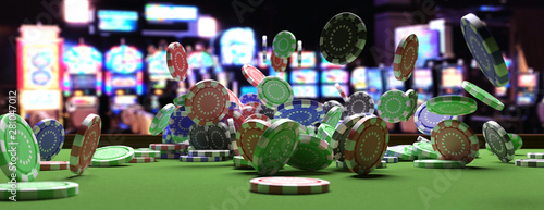 Foto Poker chips falling on green felt roulette table, blur casino interior background