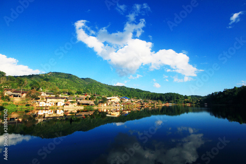 Beautiful landscape village on mountain and blue sky reflection in lake and river at Meahongson province, Thailand