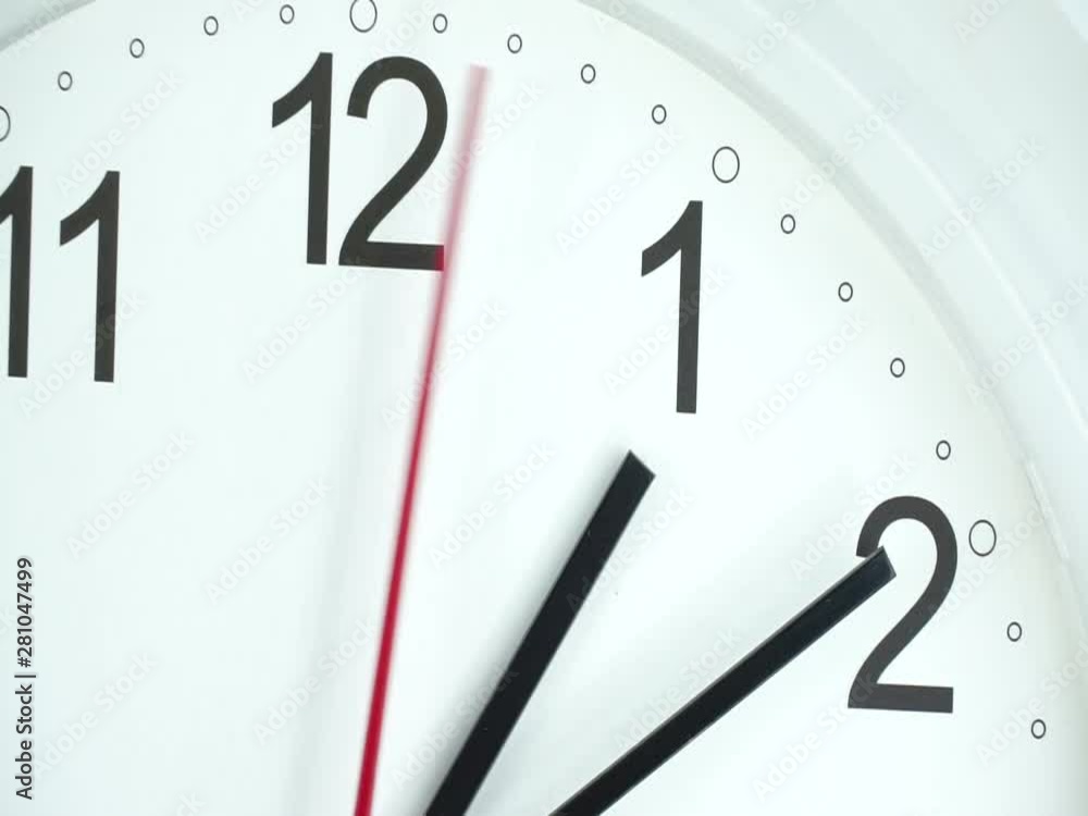 Closeup White wall clock, Black clock hands walk on white background, Time concept. Closeup White wall clock, Black clock hands walk on white background, Time concept.