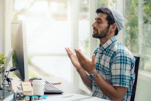 Photography muslim businessman praying and having dua to Allah asking for his business succe