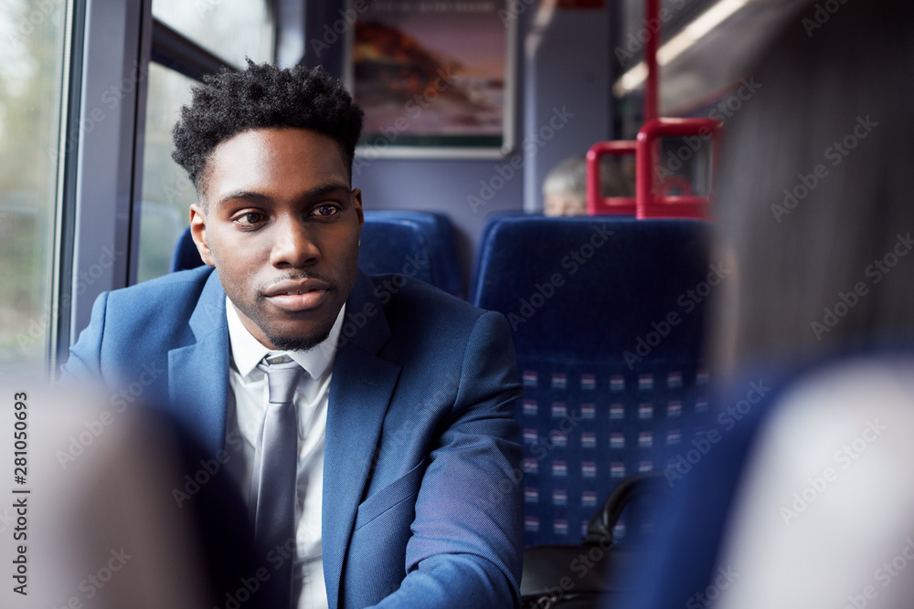 Business Passengers Sitting In Train Commuting To Work Having Discussion Business Passengers Sitting In Train Commuting To Work Having Discussion