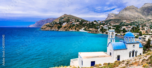 Scenery of Kalymnos island - picturesque church overloong the sea. Panormos photo