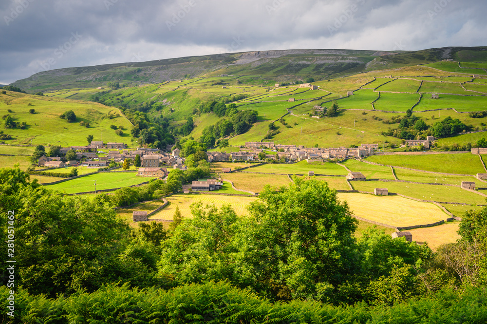 Gunnerside Village meadows and barns, in Swaledale one of the most northerly dales in the Yorkshire Dales National Park, famous for its wildflower meadows and field barns