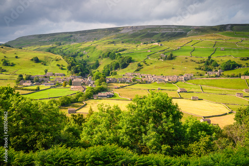 Gunnerside Village meadows and barns, in Swaledale one of the most northerly dales in the Yorkshire Dales National Park, famous for its wildflower meadows and field barns photo
