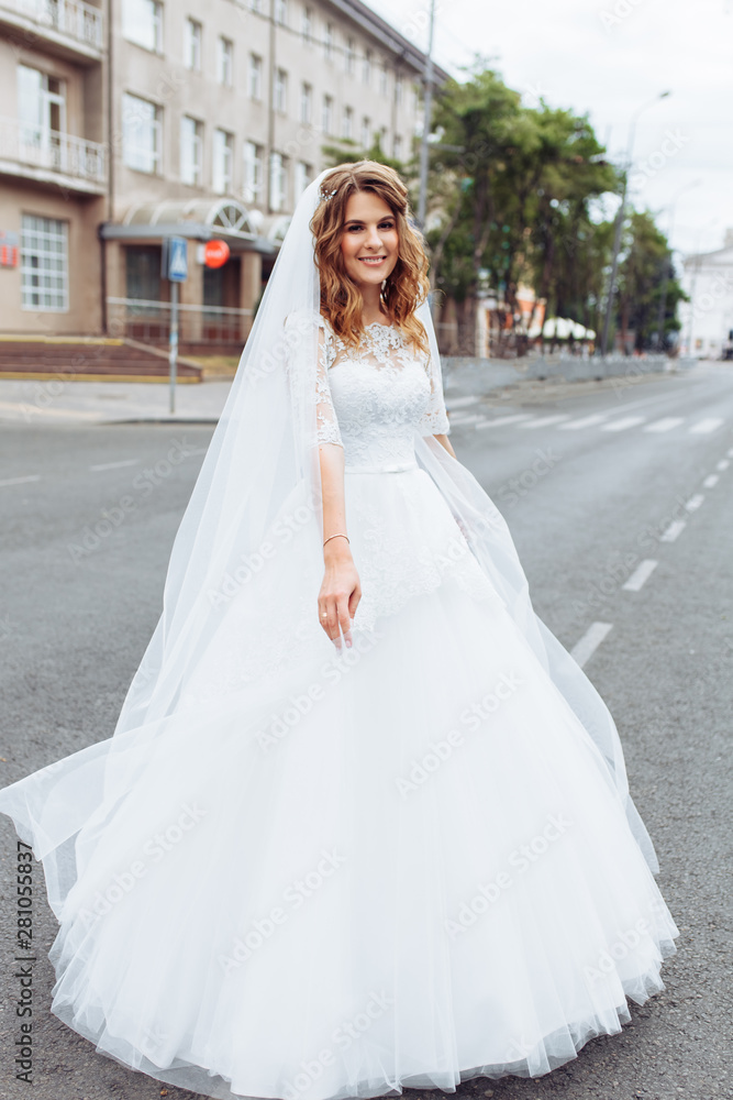 portrait of the bride in the city, young beautiful wedding bride portrait of the bride in the city, young beautiful wedding bride