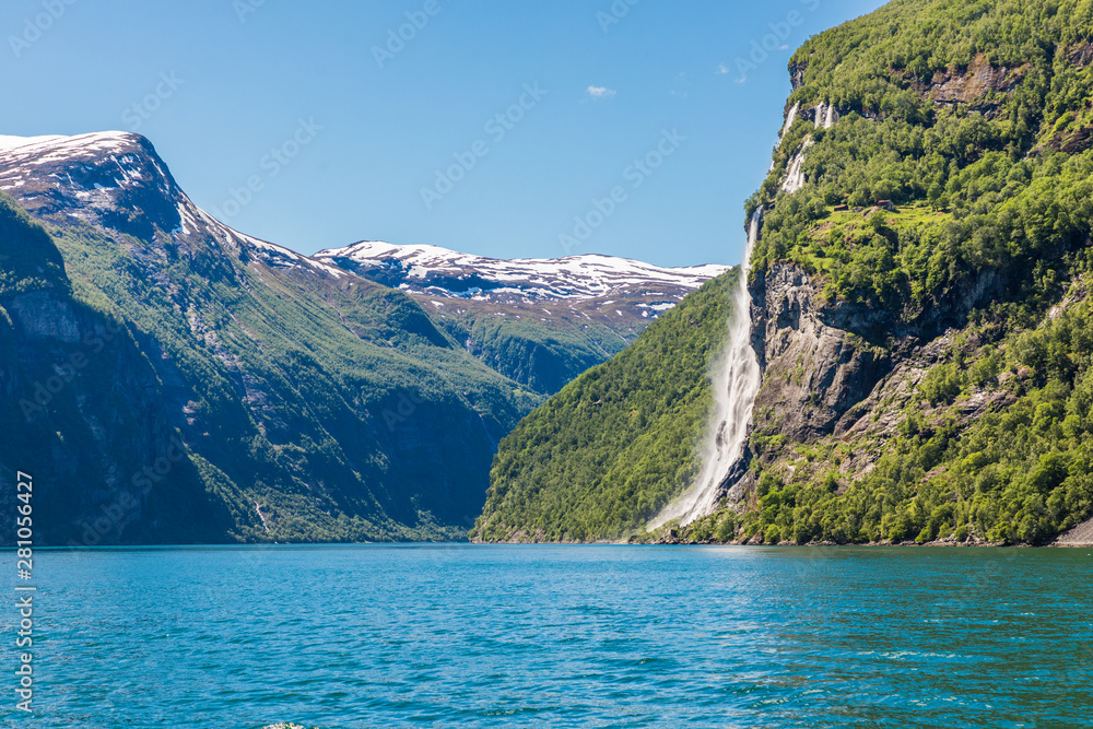 Mountain landscape with blue sky. Beautiful nature Norway. Geiranger fjord. Seven Sisters Waterfall