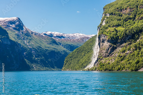 Mountain landscape with blue sky. Beautiful nature Norway. Geiranger fjord. Seven Sisters Waterfall
