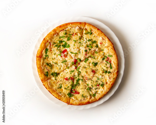 Pizza with chicken, cheese, tomatoes, sprinkled with chopped greens top view