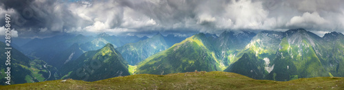 Panoramic view of summer mountains and overcast sky